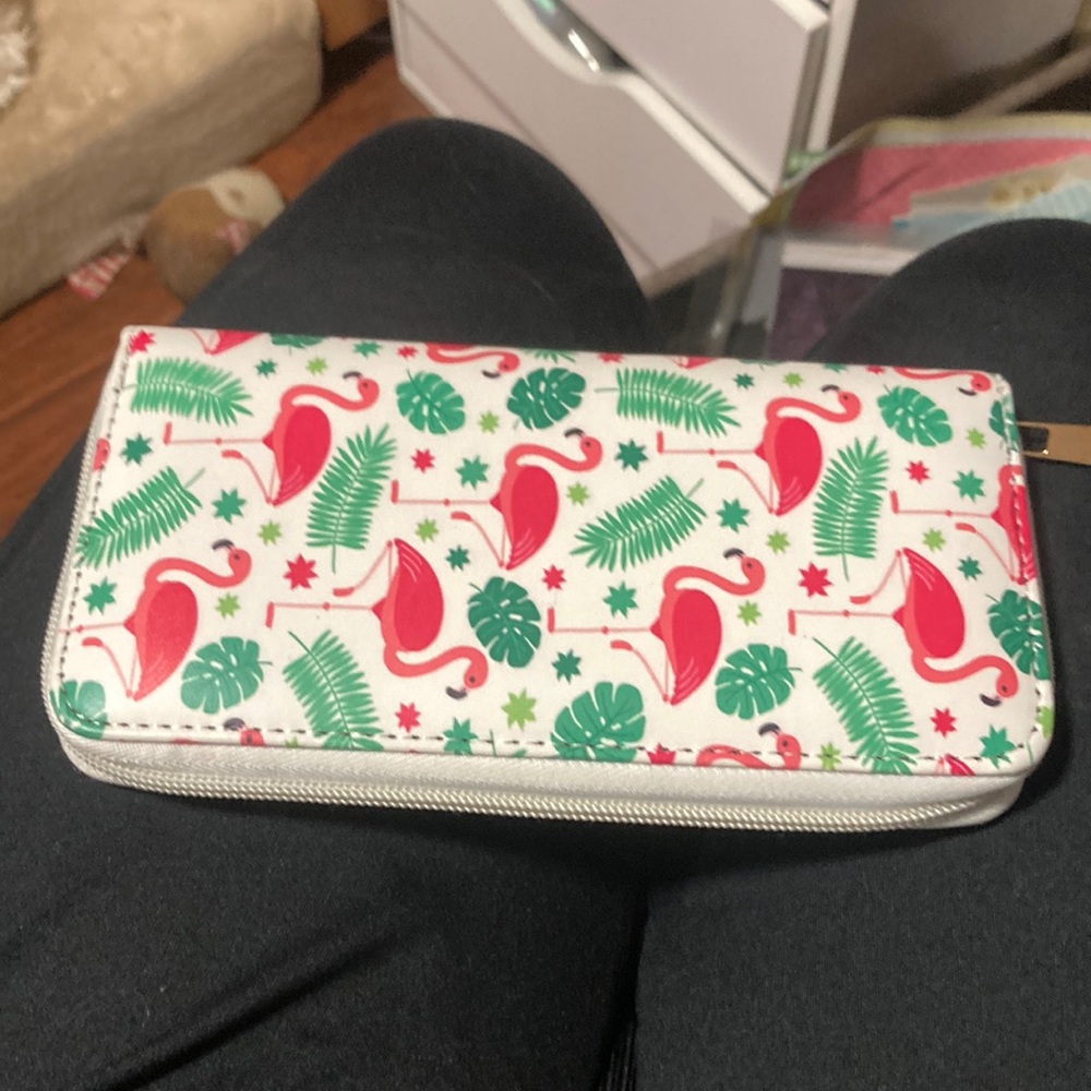 Flamingo wallet with palm leave design on it